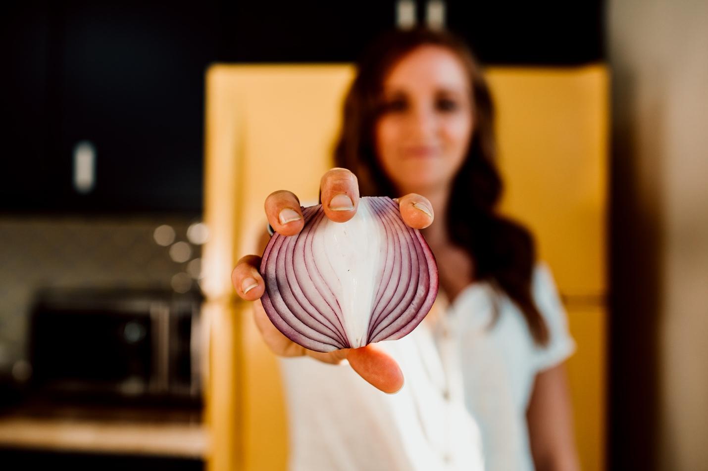 Woman holding an onion