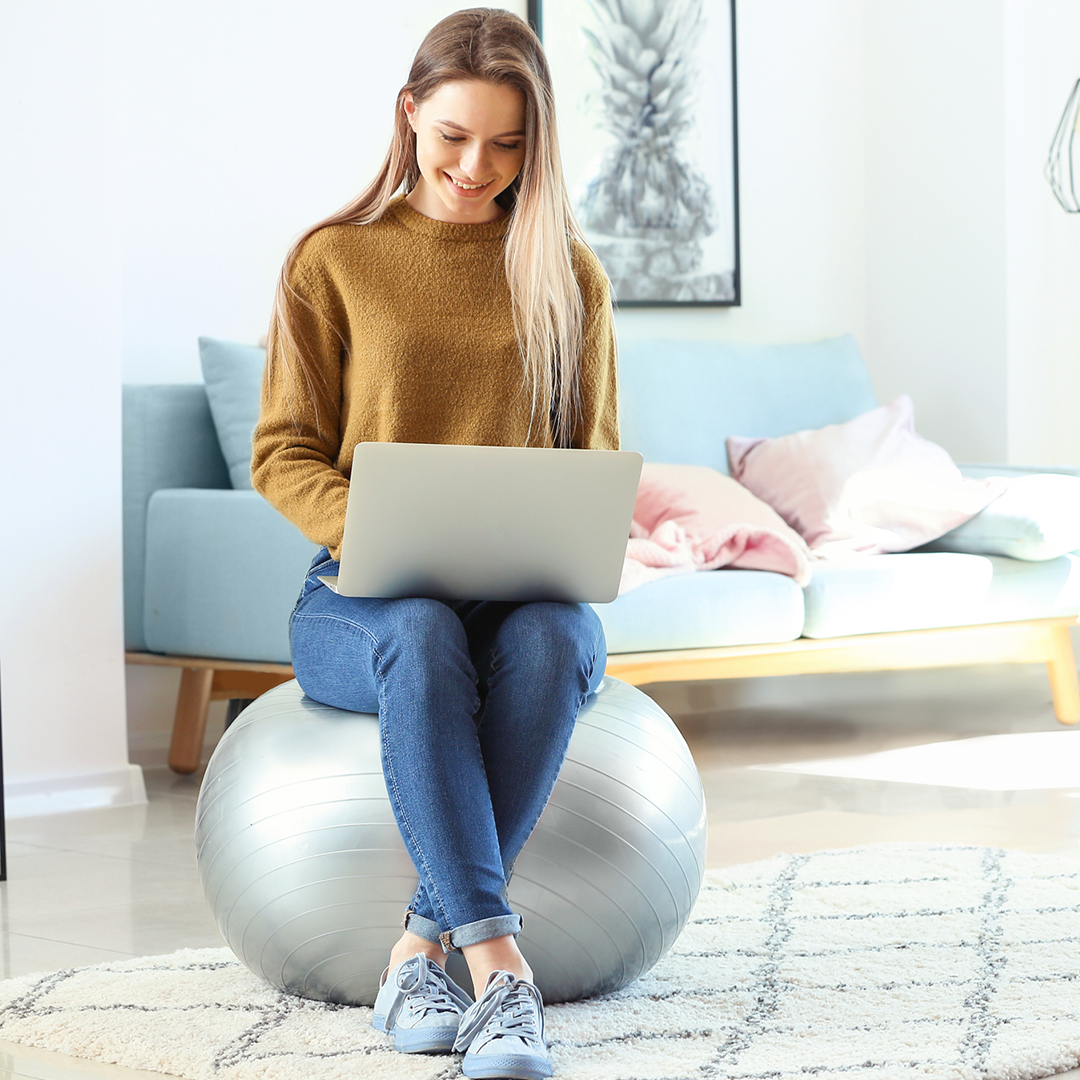 woman on laptop smiling