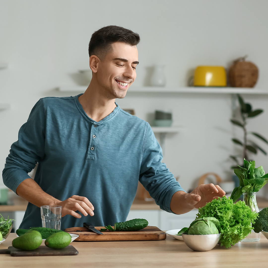 man cutting vegetables