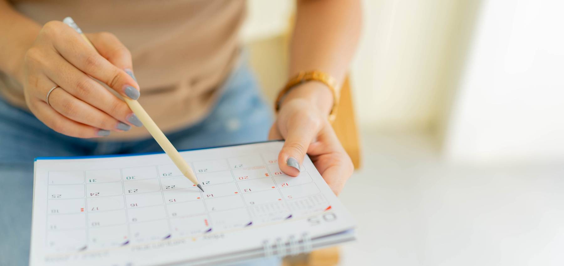 Woman-writing-in-her-planner