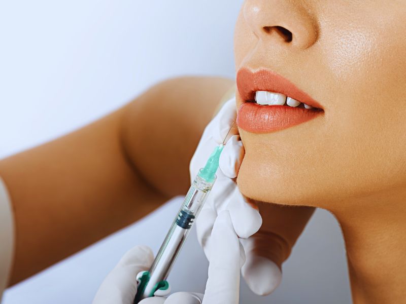 woman getting lip augmentation